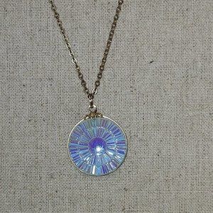Blue iridescent round Labyrinth pendant with aroura borealis with gold chain